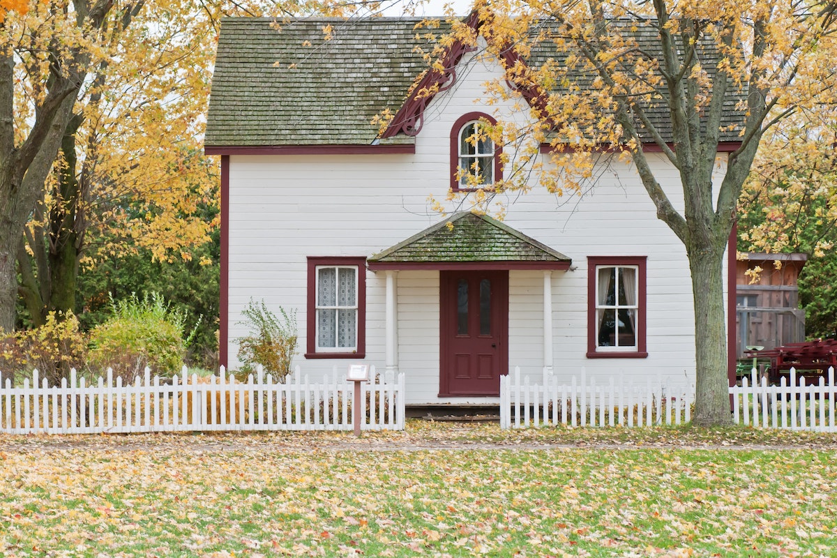 Tips on lowering your carbon footprint. House in autumn